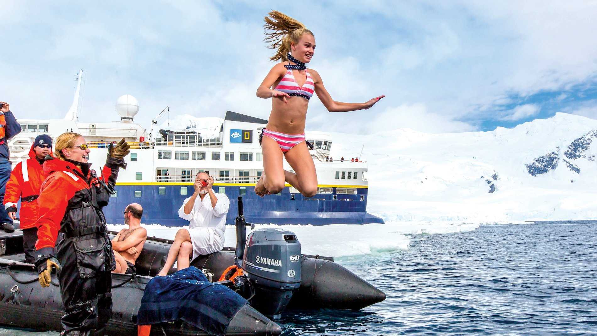 Girl takes polar plunge from Zodiac Michael S Nolan.jpg