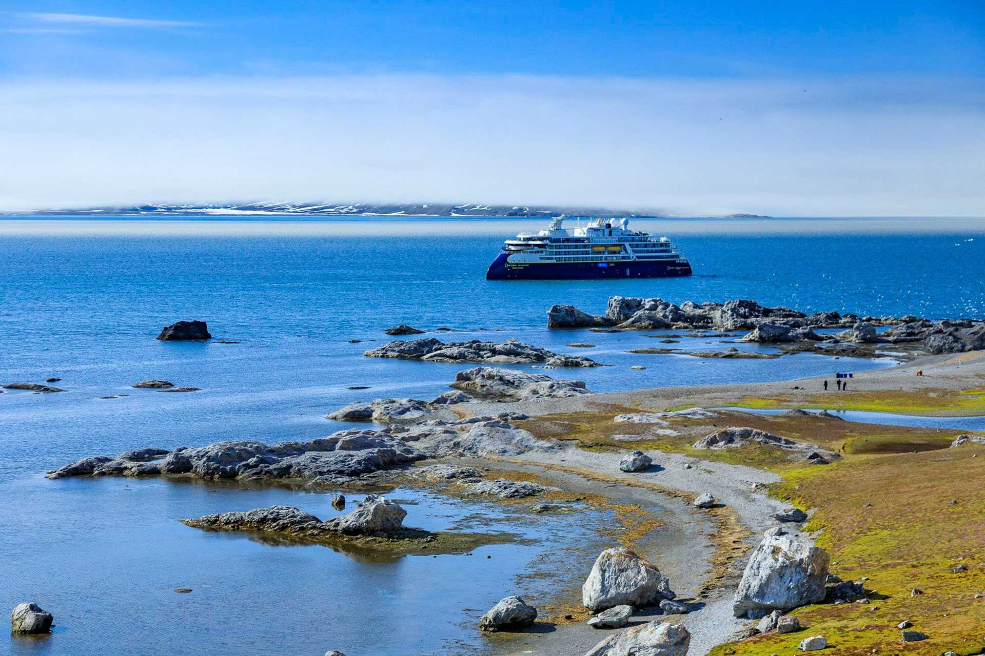 national geographic resolution ship anchored off the coast of svalbard