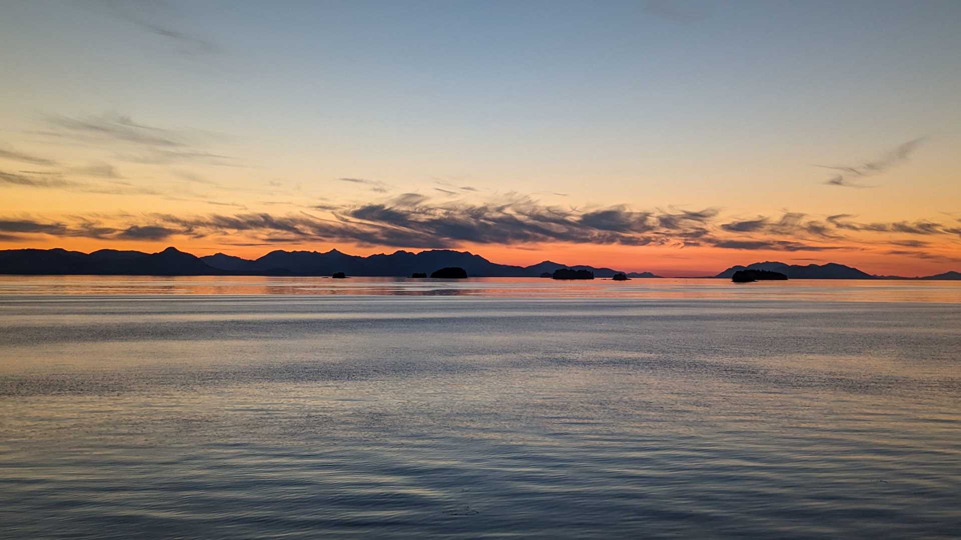 orange and red sunset over water