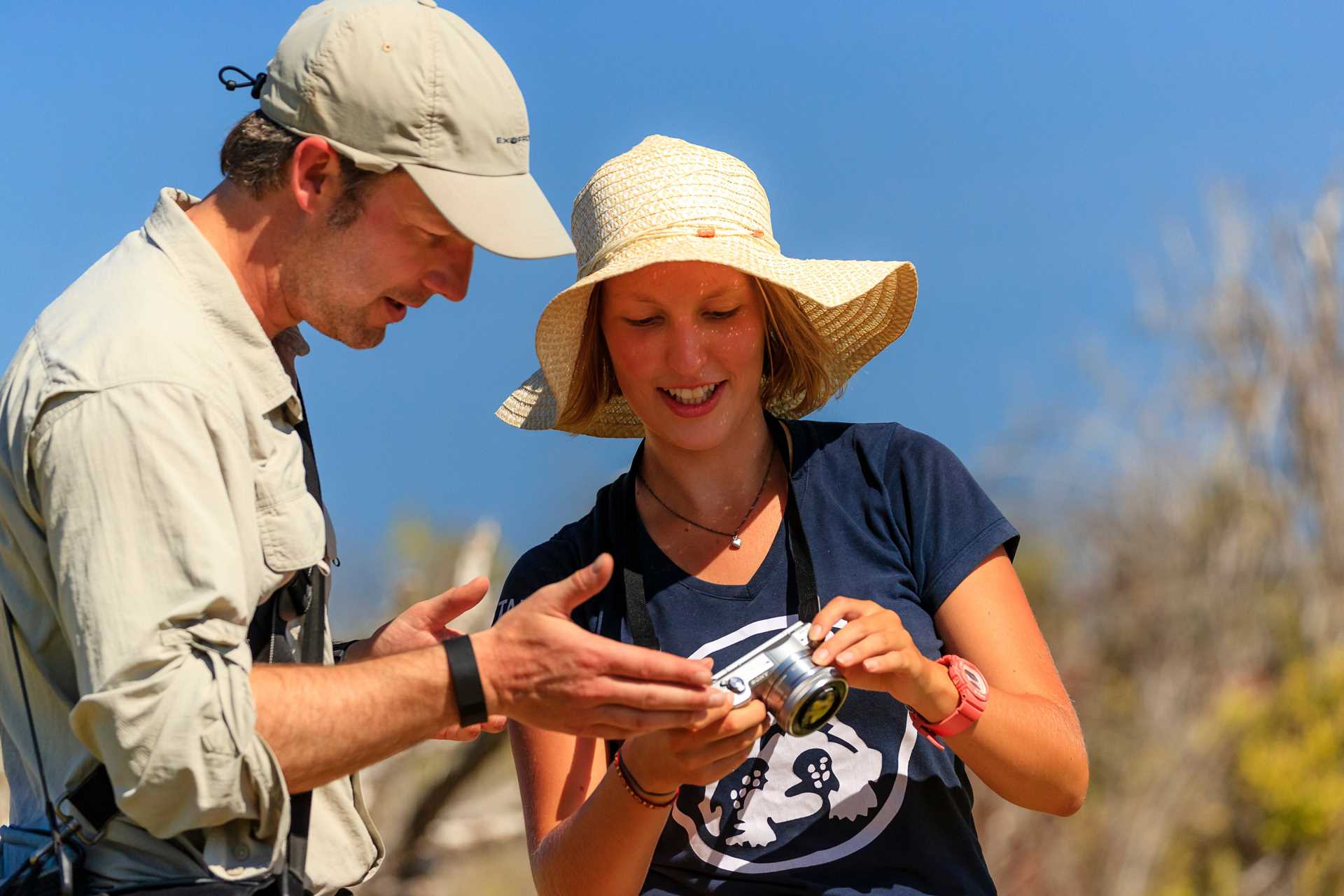 A National Geographic Photography Expert reviews a guest's photos on Santa Cruz Island.